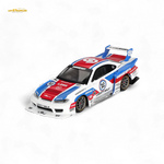Model race car with colorful design on a white background