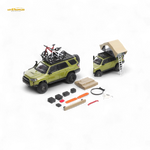 Model toy SUV with accessories on a white background