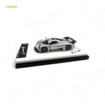 Model car on a display stand with 'Husqvarna' branding on a white background