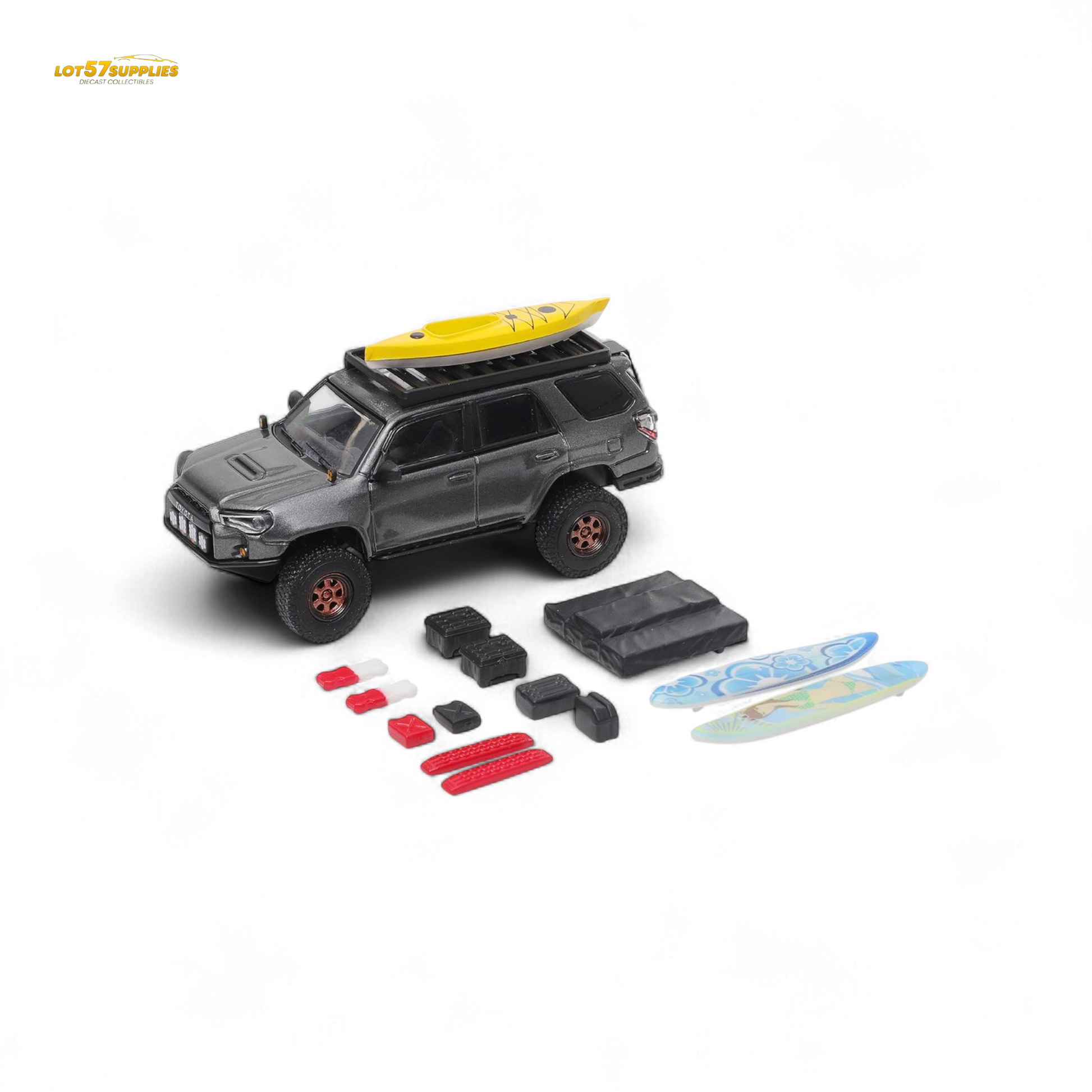Toy SUV with a surfboard on top and accessories on a white background