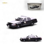 Model police car with 'State Trooper' text on a white background, featuring a Bburago branding box.