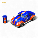 Model car with Gulf livery next to a small oil drum on a white background