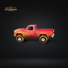 Auto World 1983 Chevrolet Silverado K10 4x4 Muddy LIFTED Squarebody 1:64