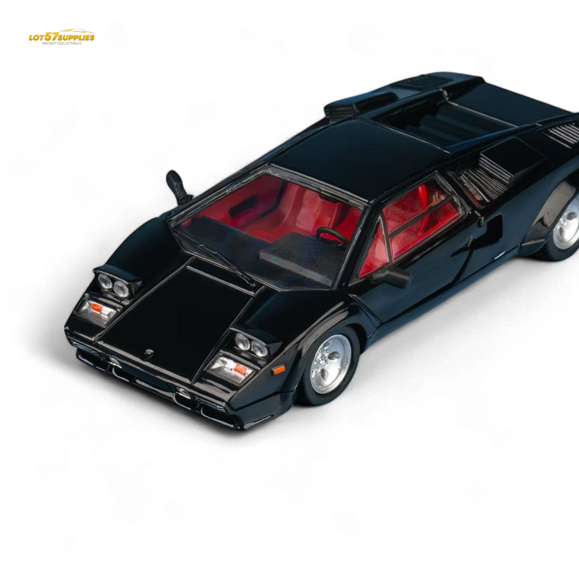 Black model car with red interior on a white background