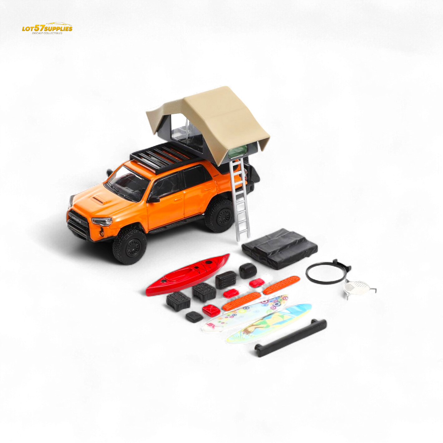Model toy truck with rooftop tent and accessories on a white background