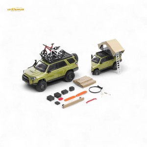Model toy SUV with accessories on a white background