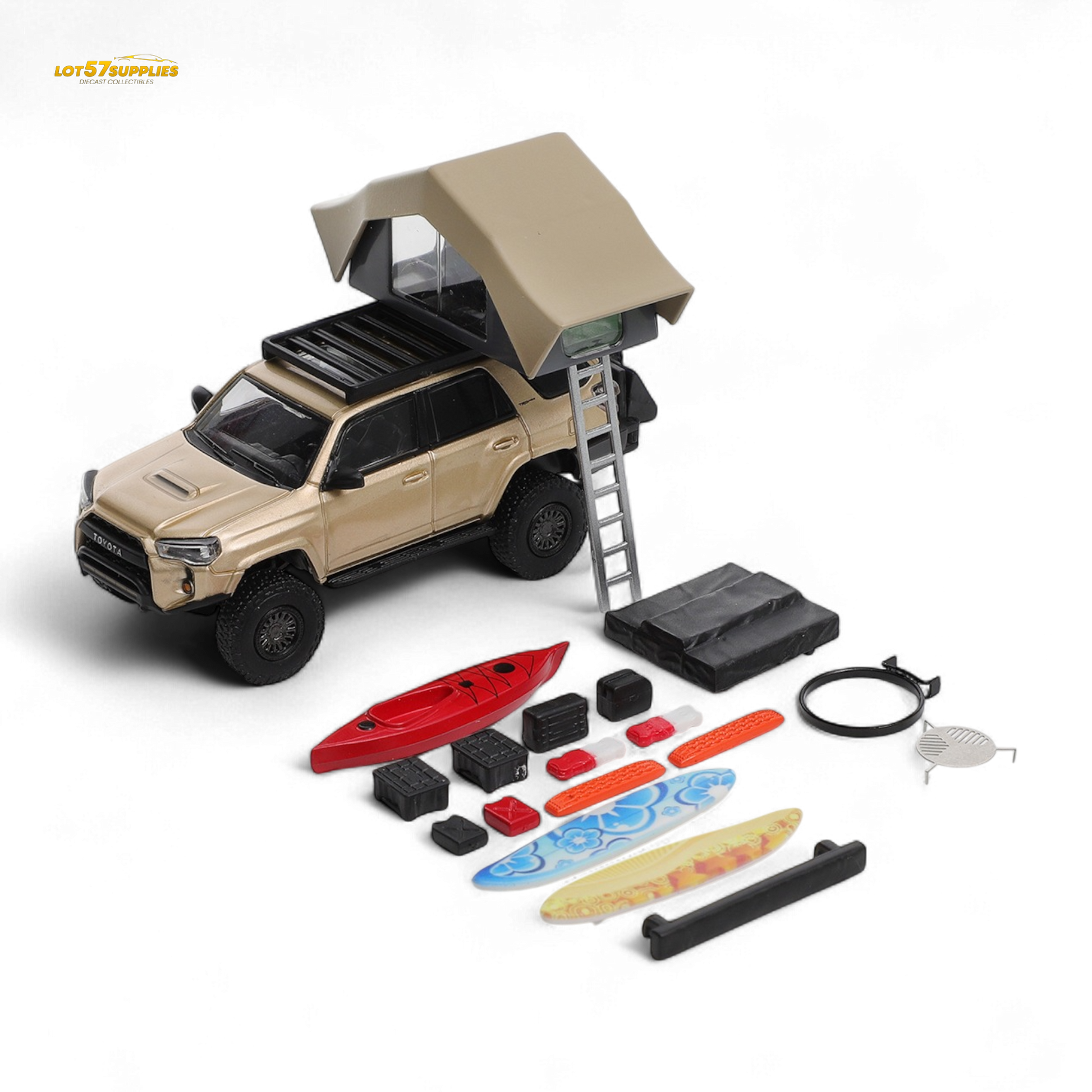 Model toy truck with rooftop tent and accessories on a white background
