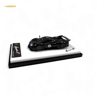 Model car on a display stand with 'Kuwyne R' branding on a white background