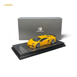 Yellow model car on a black display stand with a gray box in the background