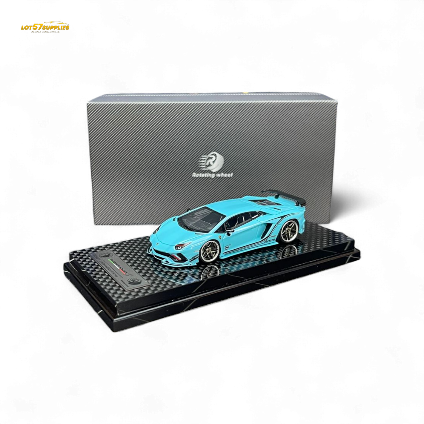 Blue model car on a black stand with a gray box in the background
