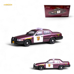 Model police car with 'State Trooper' text and a packaging box in the background.