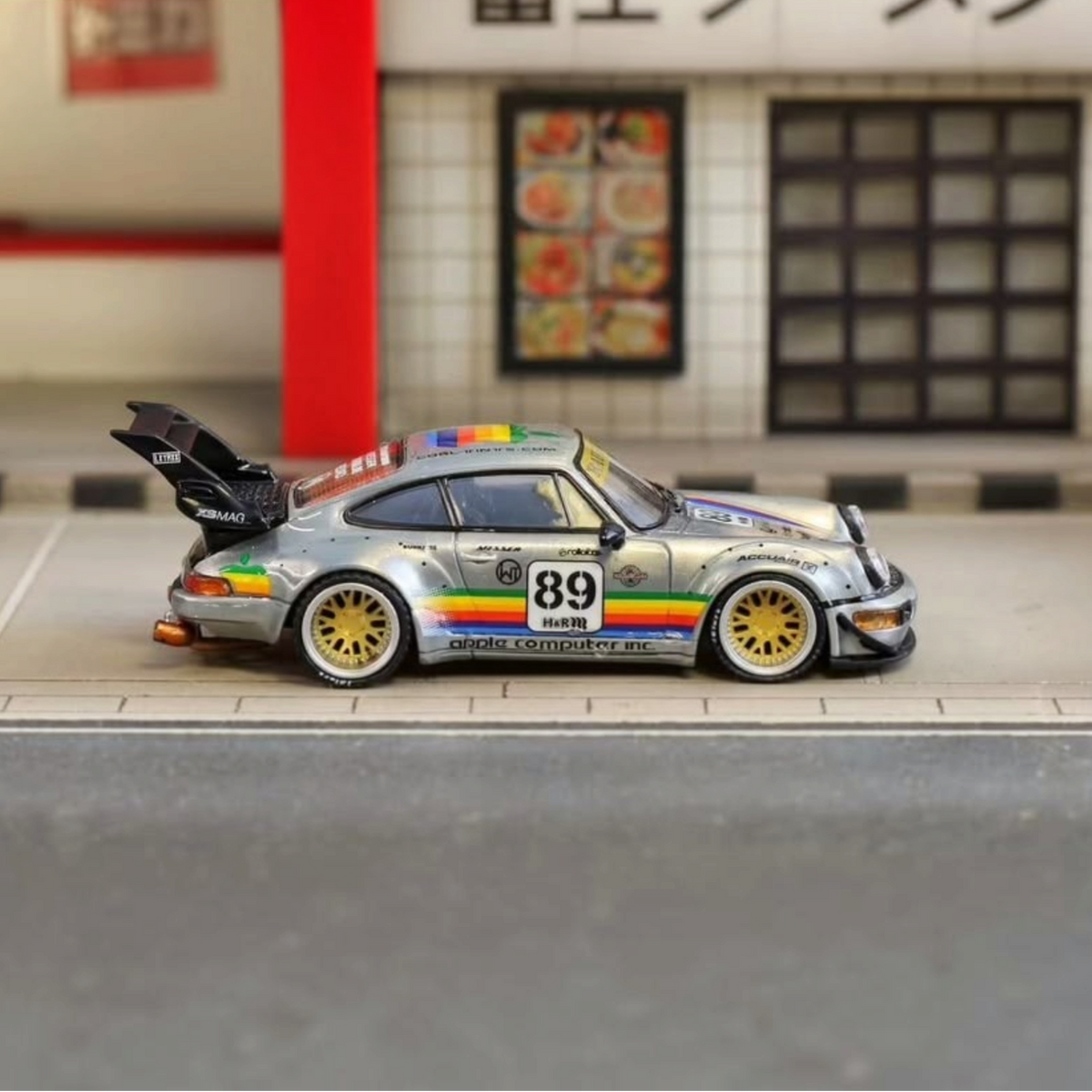 SW RWB Porsche 964 High Wing - Apple Racing Livery 1:64 diecast, side profile with high wing and rainbow stripes