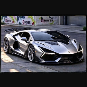 Alloy Art Lamborghini Revuelto Duke Modified Silver Gray 1:64 diecast, front three-quarter view of the real car with wing