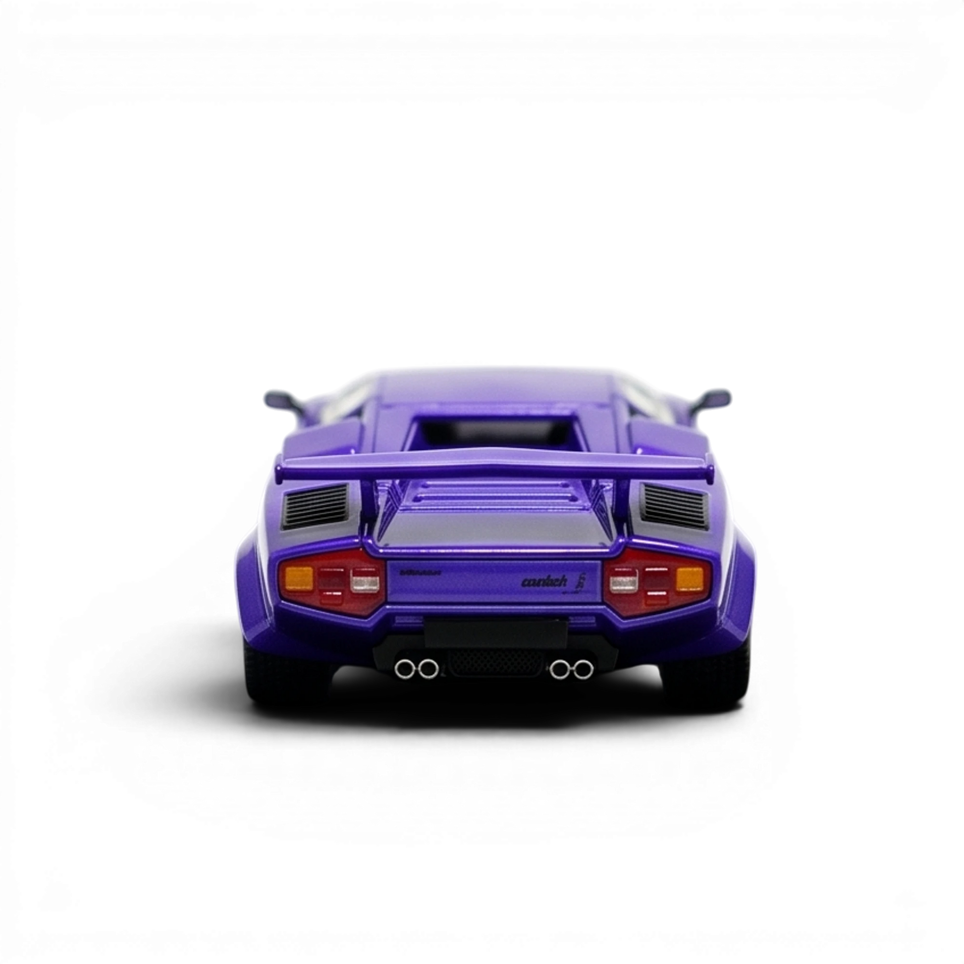 DeepMaker Lamborghini Countach 5000S 1:64 in Viola Salchi purple, straight-on rear view with taillights, engine louvres and quad exhaust.