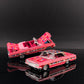 Gypsy Rose Impala convertible with doors and trunk open next to the hardtop