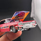 Gypsy Rose Impala held in hand with the hood up showing rose Lowrider art under the hood