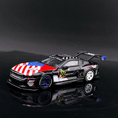 GT model Ford Mustang GT3 Black Monster 1:64 diecast, front three-quarter view with flag-print bonnet and rear wing