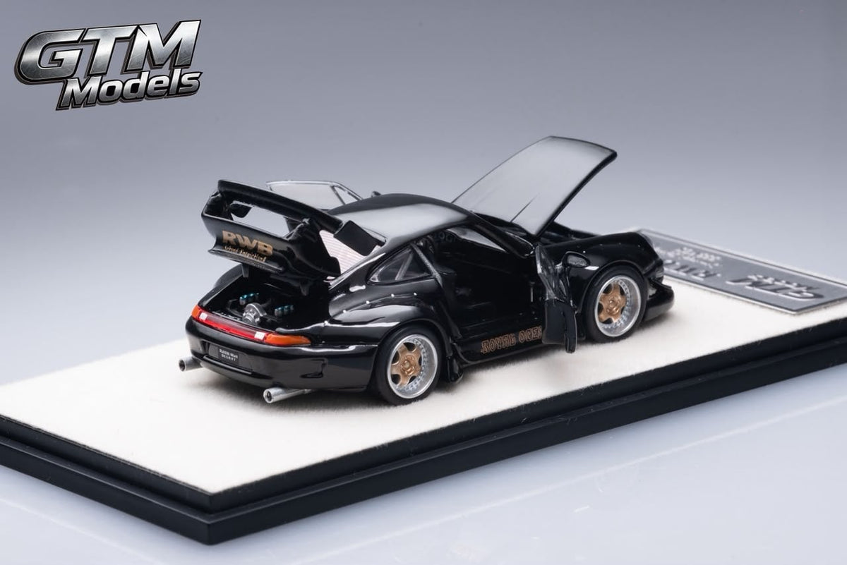 Rear three-quarter view of the black RWB 993 with doors, engine lid and rear wing open