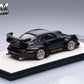 Rear three-quarter view of the black RWB 993 with ducktail wing and bronze wheels