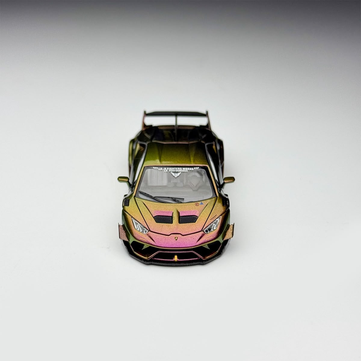 Front view of the chameleon Huracan GT showing the vented hood and purple to gold color shift