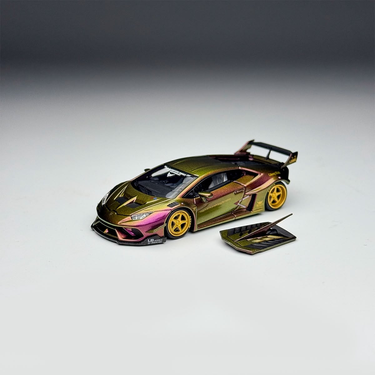 Chameleon Huracan GT with its front hood panel removed and set beside the car