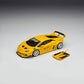 Yellow Huracan GT with its front hood panel removed and set beside the car
