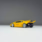 Rear three-quarter view of the yellow Huracan GT, no rear bumper, exposed engine and exhaust