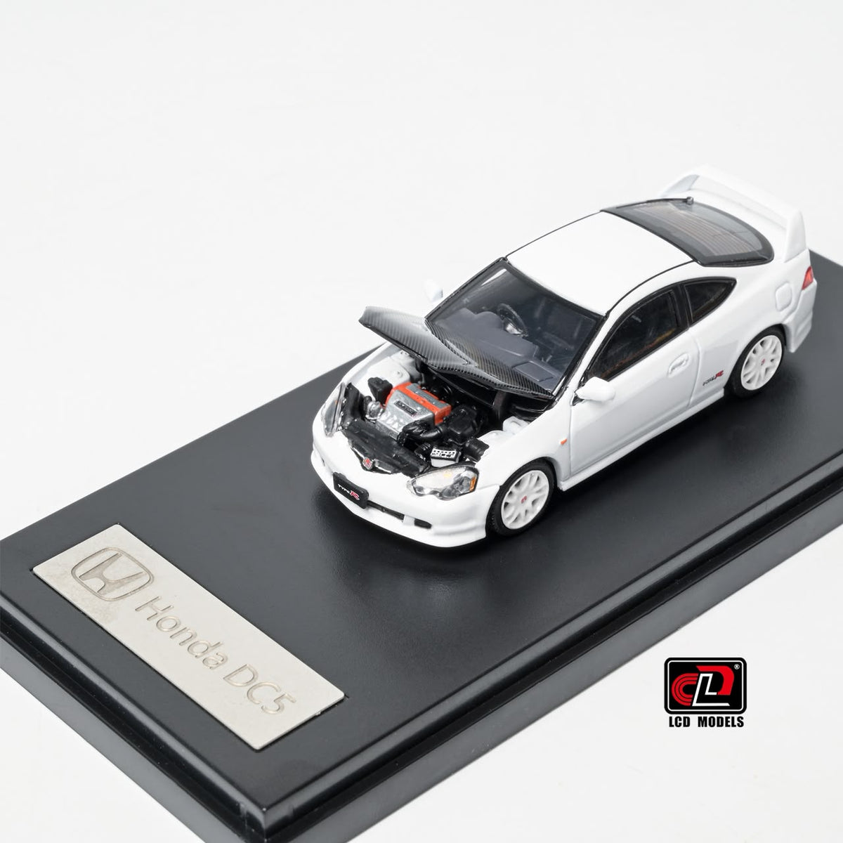 LCD Honda Integra DC5 Type-R 1:64 in white, front three-quarter with the carbon bonnet raised over the detailed engine bay