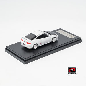 LCD Honda Integra DC5 Type-R 1:64 in white, rear three-quarter showing the tail lights, rear wing and carbon roof panel on the black display base