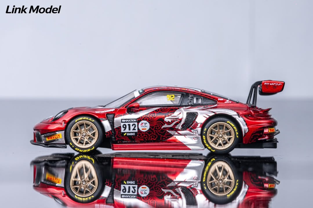 Side profile of the #912 Chinese Dragon 911 GT3 R with dragon art along the doors