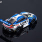 Rear three-quarter view of the white and blue H&R 911 GT3 R with Muhlner Motorsport rear wing