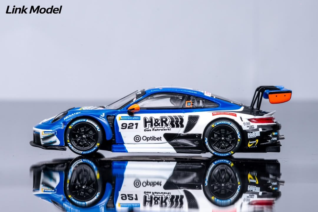 Side profile of the #921 H&R 911 GT3 R with Optibet sponsor decals