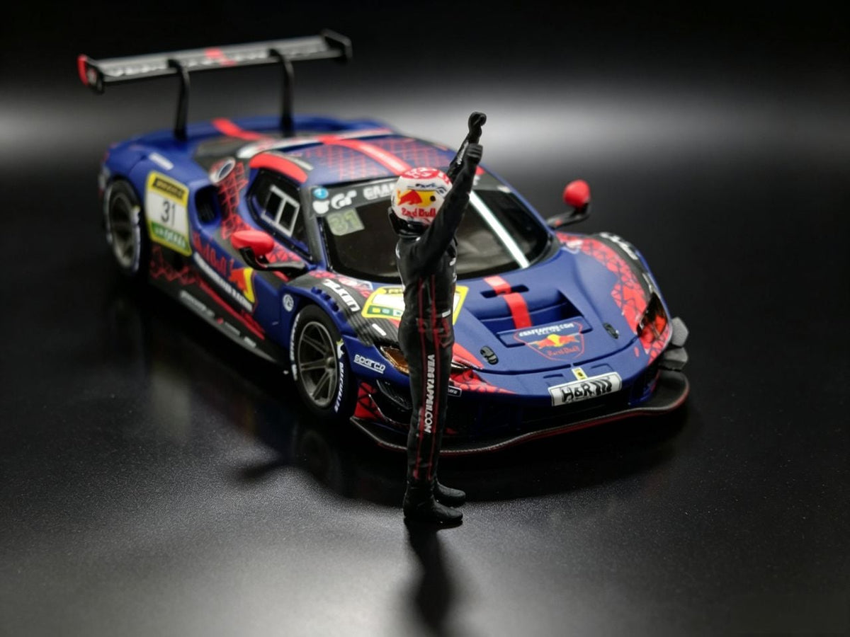 MechSpeed 296GT3 1:64, blue Red Bull #31 livery, front three-quarter close-up with the driver figure in a Red Bull helmet raising one arm