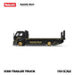 Side profile of the black H300 trailer truck with gold RAUH-Welt Begriff door script and gold wheels