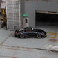 Star Models 1:64 Porsche 997 widebody in gloss black, full side profile showing the widebody fenders