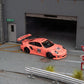 Star Models 1:64 Porsche 997 widebody in Pink Pig livery with number 23 roundel, front three-quarter from the right