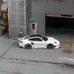 Star Models 1:64 Porsche 997 widebody in white with a carbon roof, full side profile showing the widebody fenders
