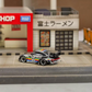 SW RWB Porsche 993 Apple Racing Livery Low Wing 1:64 diecast, rear three-quarter with low wing in street diorama