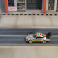 SW RWB Porsche 993 Apple Racing Livery Low Wing 1:64 diecast model, side profile on a street diorama
