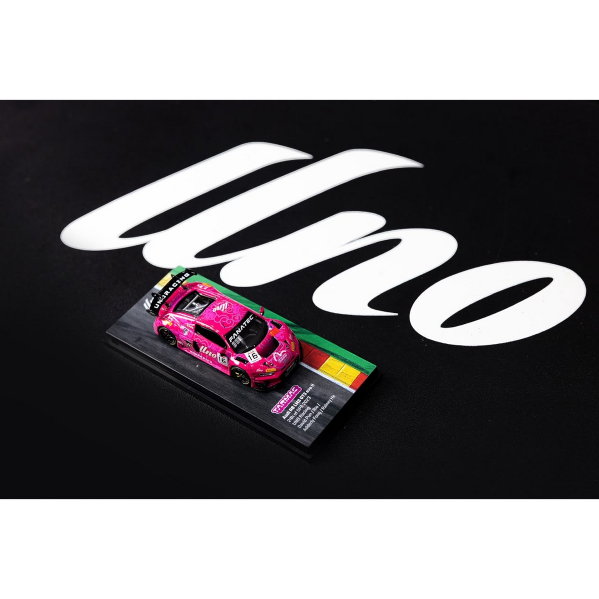 Lot57Supplies Diecast Shop 1:64 scale pink Audi R8 LMS GT3 EVO II diecast model car on a display base