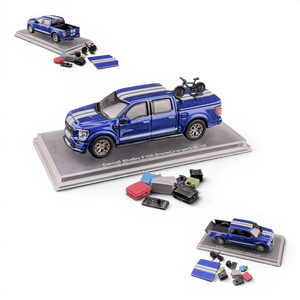 Lot57Supplies Diecast Shop blue 1:64 scale Ford Shelby F-150 pickup truck with white racing stripes and a bicycle on the bed cover.