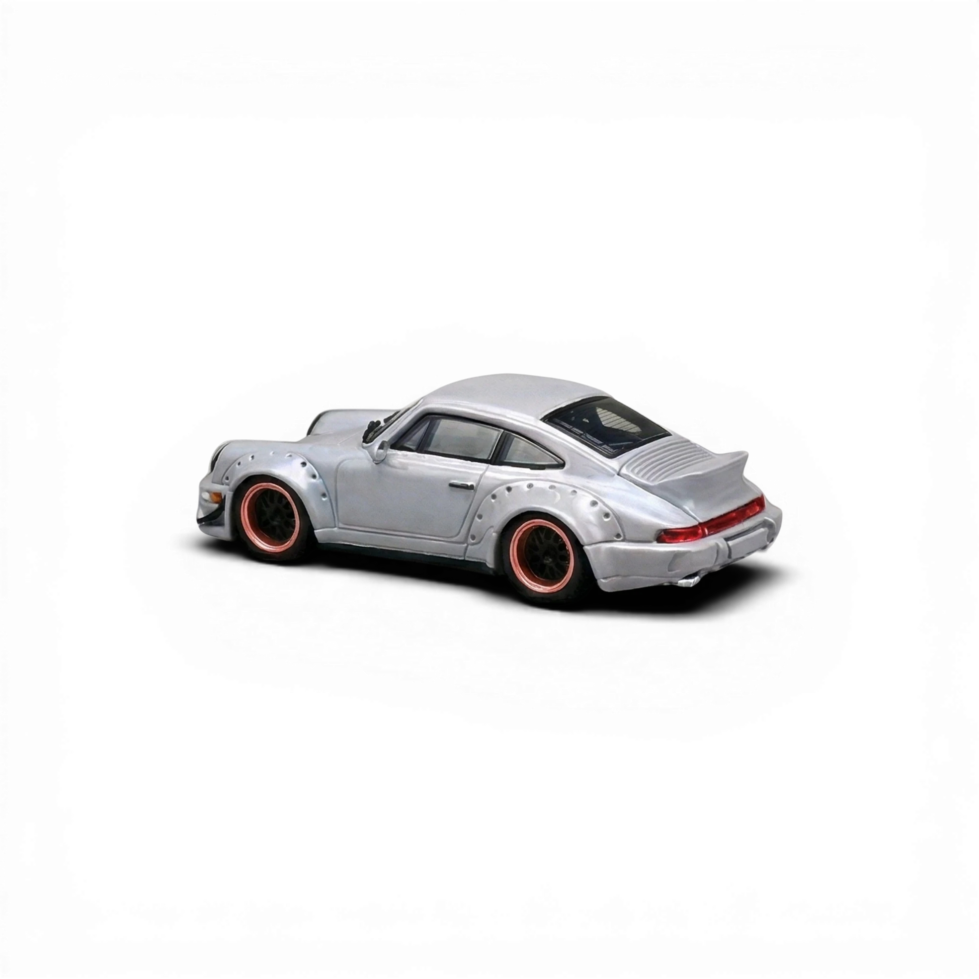 Lot57Supplies Diecast Shop CM Model Porsche 964 widebody diecast model car, gray with copper-rimmed wheels and snap-on feature.
