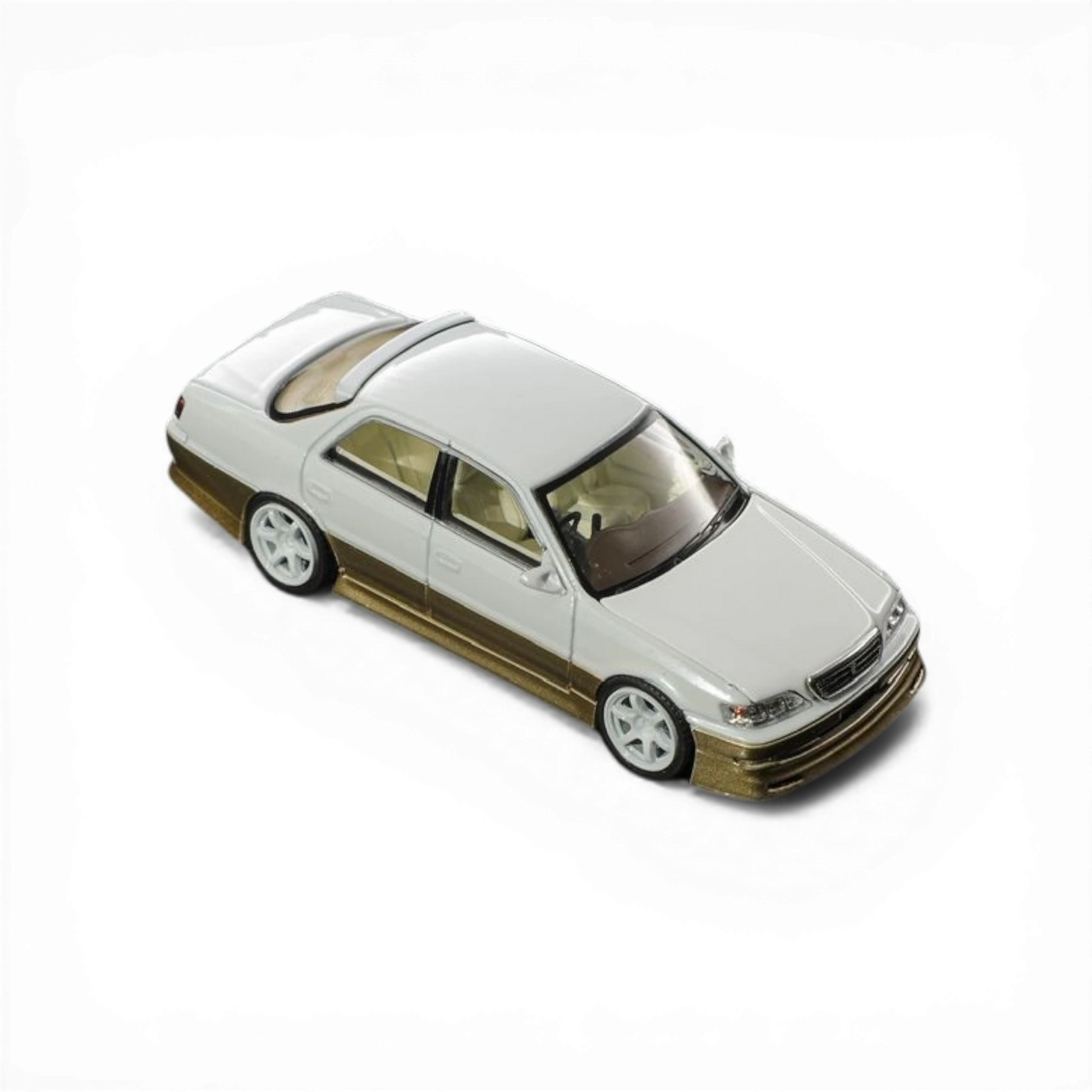 Lot57Supplies Diecast Shop 1:64 scale pearl white and gold diecast Cresta model car with metallic paint.
