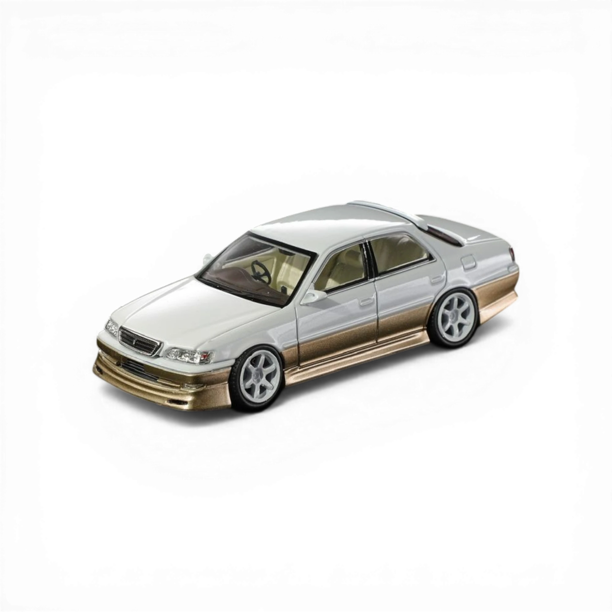 Lot57Supplies Diecast Shop 1:64 scale pearl white and gold diecast Cresta model car with metallic paint.