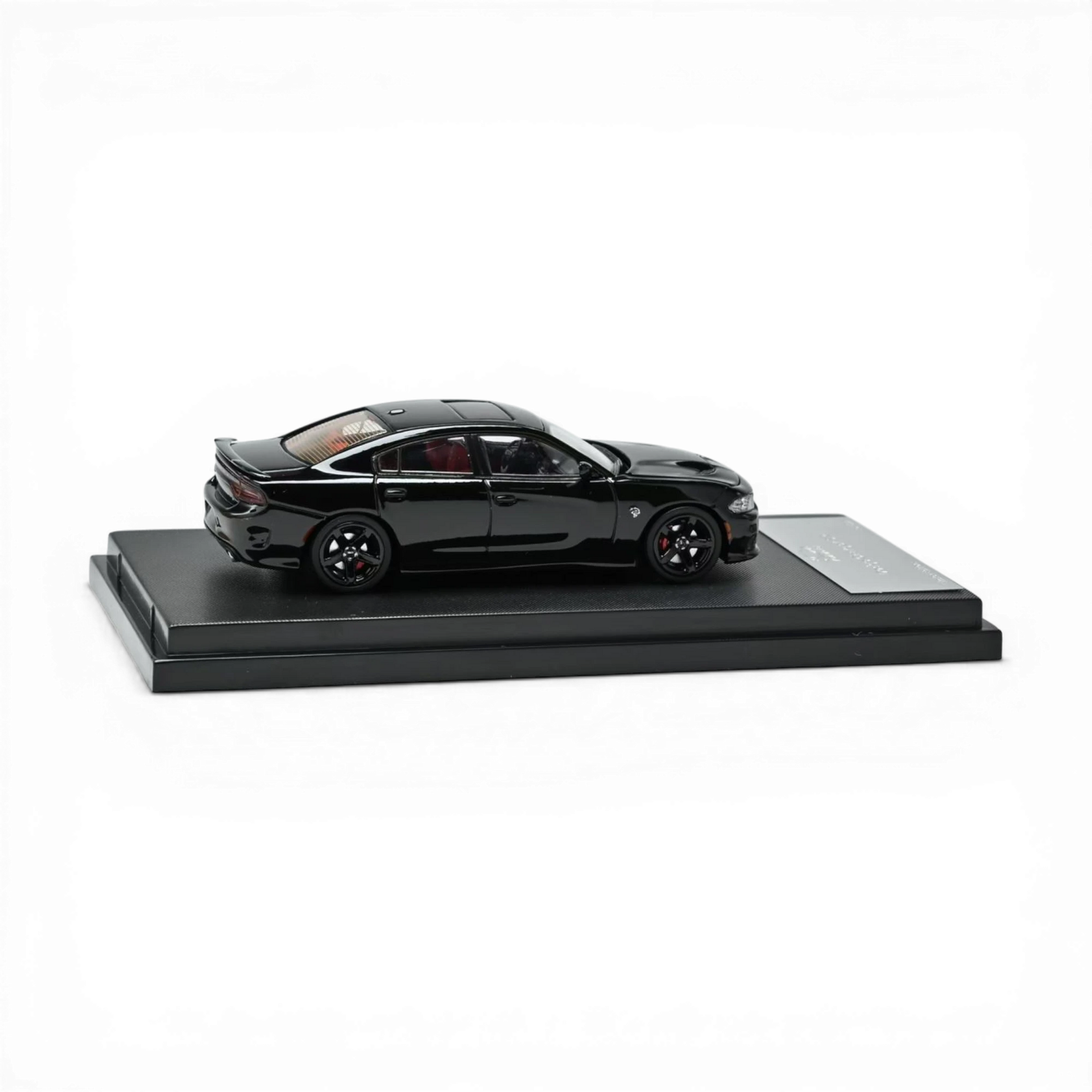 Lot57Supplies Diecast Shop 1:64 scale pitch black 2023 Dodge Charger SRT Hellcat diecast model with red interior and black wheels.