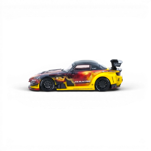 Lot57Supplies Diecast Shop: Yellow and black 1:64 scale INNO64 Honda S2000 J's Racing AP1 diecast model with flame graphics and large rear spoiler.