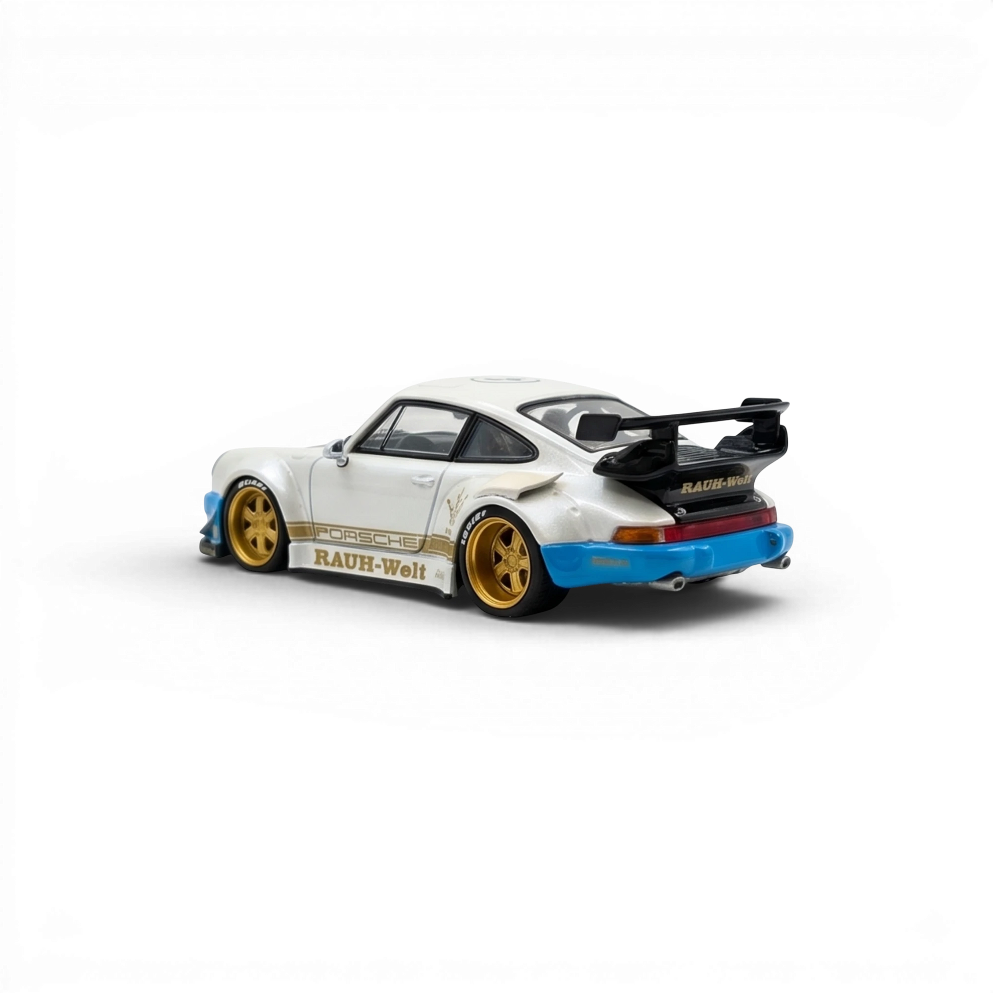 Lot57Supplies Diecast Shop 1:64 scale matte white Porsche RWB 930 model car with gold wheels and blue accents.