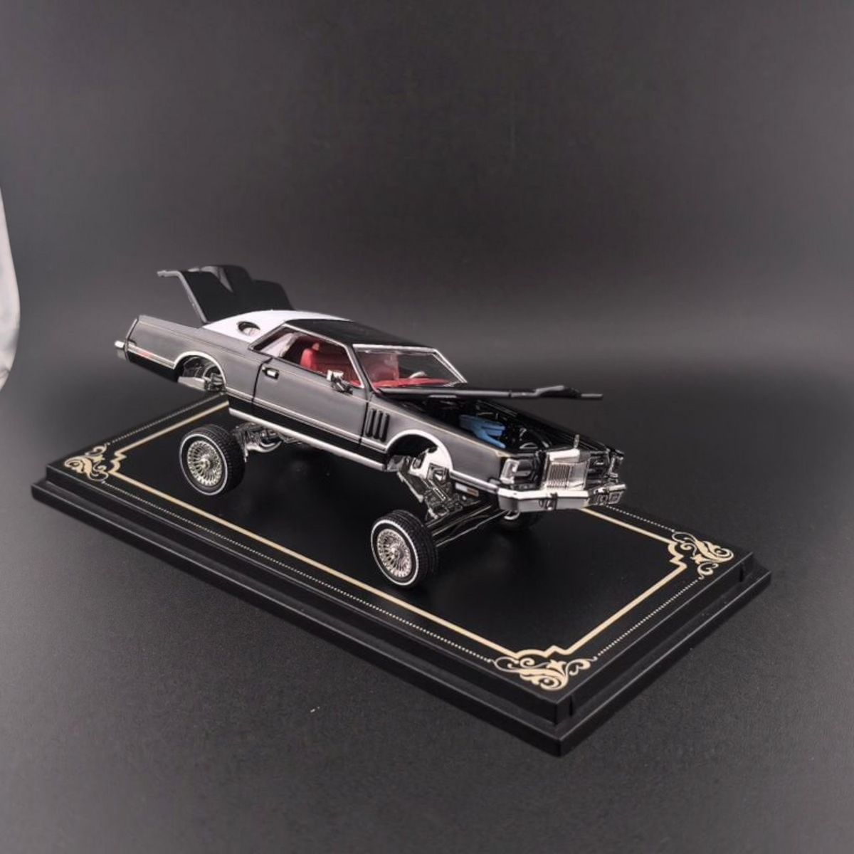 Lot57Supplies Diecast Shop Fine Works64 1979 Lincoln Continental lowrider diecast model in black with open hood and trunk