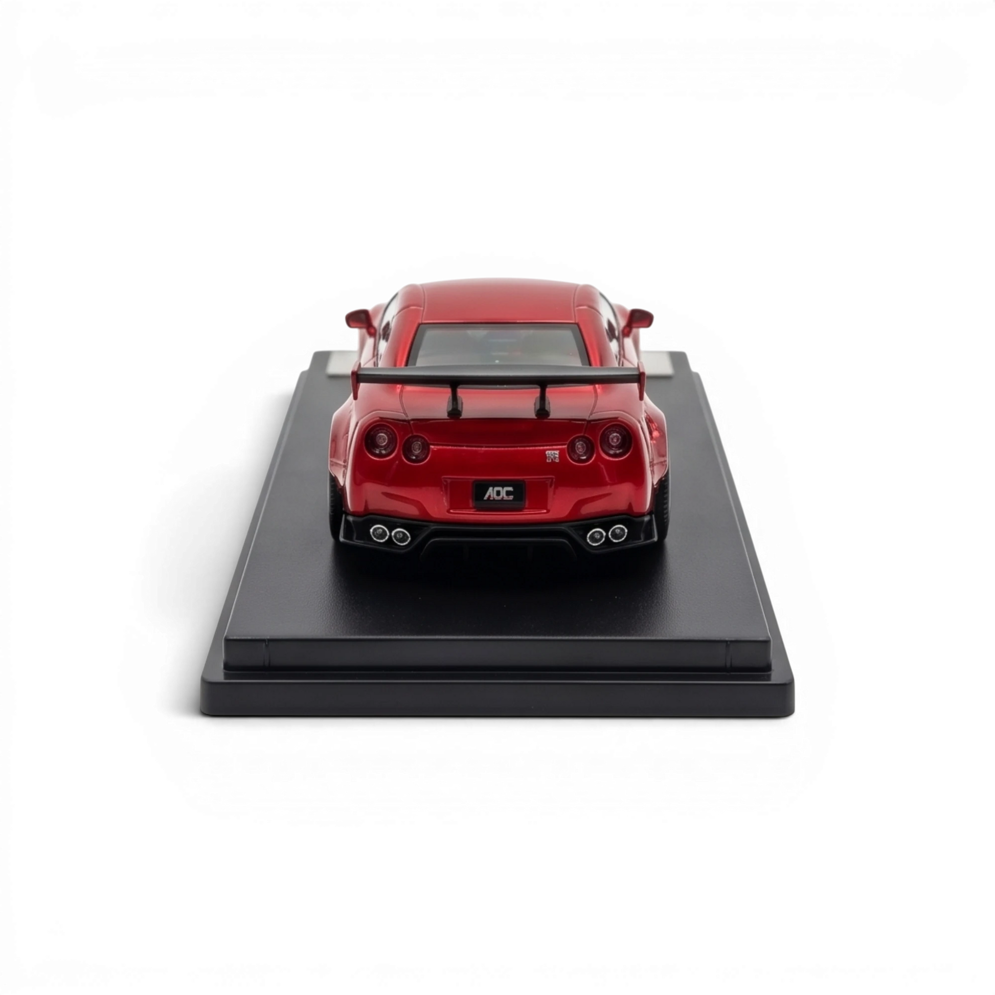 Lot57Supplies Diecast Shop metallic red AOC GT-R 35 RR 1:64 scale diecast model car with spoiler and quad exhaust pipes.