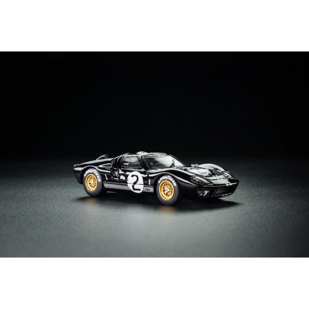 Lot57Supplies Diecast Shop G&KH Ford GT40 Mk II #2 diecast model car in black with gold wheels on a dark background